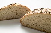 Wholemeal bread with pumpkin seeds, halved