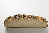 Slice of pumpkin seed bread