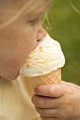 Small girl eating an ice cream cone