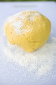 Ball of dough sprinkled with flour