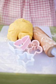 Ball of dough, biscuit cutters and rolling pin