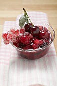 Red berry compote in glass dish