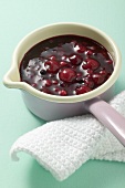 Red berry compote in pan