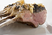 Rack of lamb with pesto crust and pine nuts