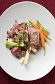 Roast beef on vegetables