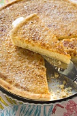 Caramel tart, partly sliced