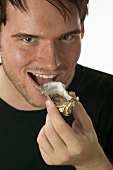 Man eating a fresh oyster