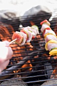 Poultry kebabs on barbecue grill rack