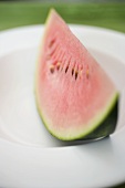 Wedge of watermelon on plate