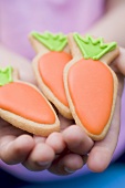 Child's hands holding Easter biscuits