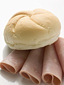 Bread roll on slices of ham