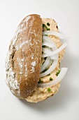Bread roll filled with Obatzda (Camembert spread) & onions