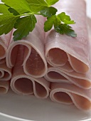 Ham rolls garnished with parsley (close-up)