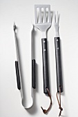 Barbecue tools (tongs, carving fork, spatula)