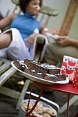 Brownies at a garden party for 4th of July, woman in background