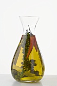 Chilli oil with green peppercorns in a carafe