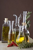 Various types of oil in carafes and bottles