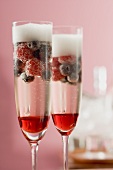 Sparkling wine cocktails with liqueur and berries