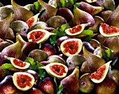 Fresh figs, whole and halved (full-frame)