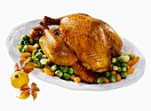 Roast turkey on vegetables