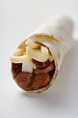 Wrap filled with beans, cheese and onion