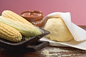 Tortilla dough and corn on the cob