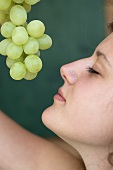 Woman with green grapes
