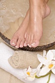Woman enjoying a soothing foot bath