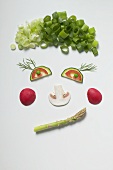 Amusing face made from vegetables, dill and mushroom