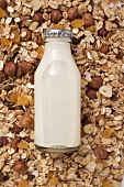 Cereal and bottle of milk (close-up)