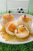 Apricot dumplings with football figures
