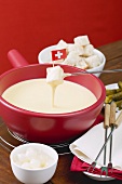 Cheese fondue with Swiss flag