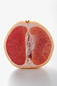 Half a pink grapefruit (longitudinal section)