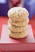 Four sugared biscuits, stacked, on red box