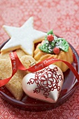 Christmas biscuits and Christmas tree ornaments on plate