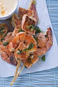 Salmon and prawn skewers with mint and sauce