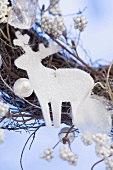 White reindeer on Christmas wreath (close-up)