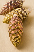 Three fir cones (Christmas tree ornaments)