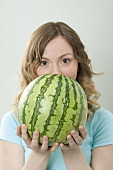 Woman holding watermelon