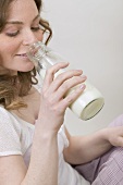 Woman drinking milk out of bottle
