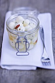 Marinated cheese balls in jar