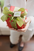 Woman holding Christmas gift