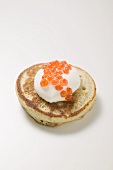 Blini with sour cream and caviar