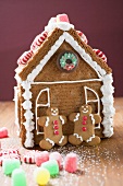Gingerbread house with two gingerbread men