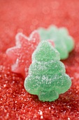Jelly sweets on red sugar