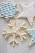 Four iced Christmas biscuits