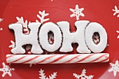Christmas sweets (the word HOHO and peppermint stick)