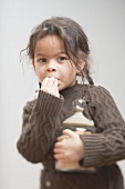 Small girl eating shortbread