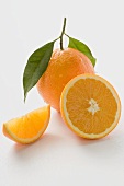 Orange with stalk and leaf, orange half and wedge