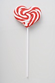 Heart-shaped candy cane lollipop
